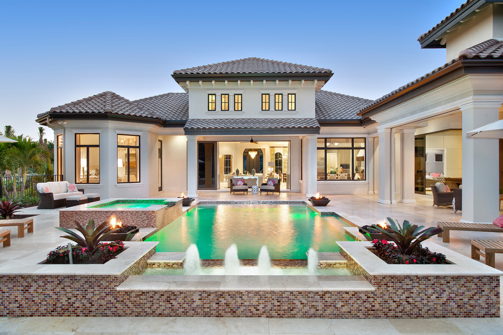 Inspiration for a large transitional backyard custom-shaped pool in Tampa.