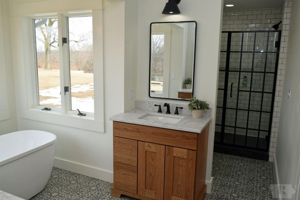 Mid-sized country master bathroom in Other with flat-panel cabinets, light wood cabinets, a freestanding tub, a corner shower, white walls, mosaic tile floors, a drop-in sink, quartzite benchtops, multi-coloured floor, a hinged shower door and white benchtops.