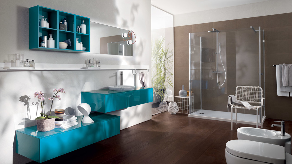 Mid-sized modern master bathroom in Melbourne with a drop-in sink, raised-panel cabinets, blue cabinets, glass benchtops, an alcove shower, a two-piece toilet, white walls and medium hardwood floors.