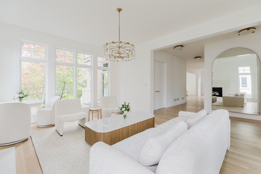 Spacious Modern Living Room with White Furniture and Large Windows
