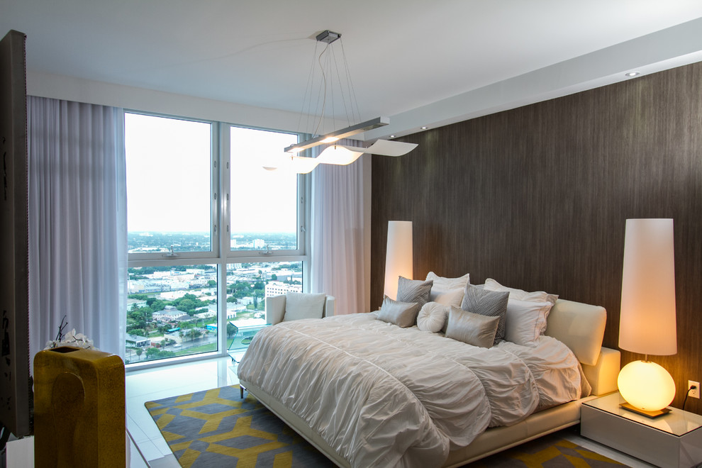 Inspiration for a contemporary bedroom in Miami with grey walls.