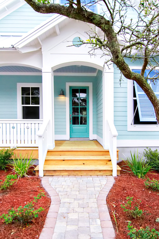 Photo of a beach style entryway in Jacksonville with a single front door.