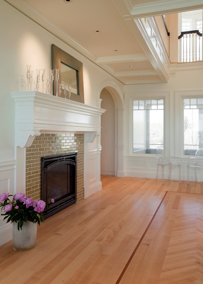 This is an example of a large traditional formal open concept living room in Boston with white walls, light hardwood floors, a standard fireplace, a tile fireplace surround and no tv.
