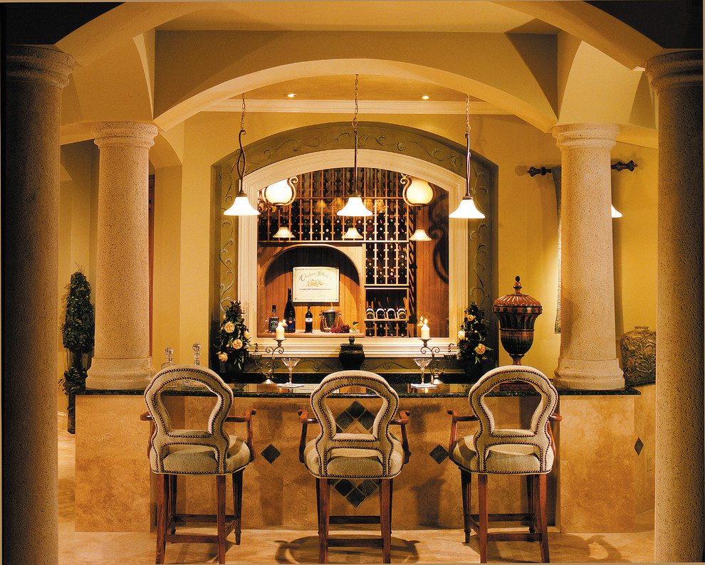 This is an example of a large mediterranean home bar in Miami.
