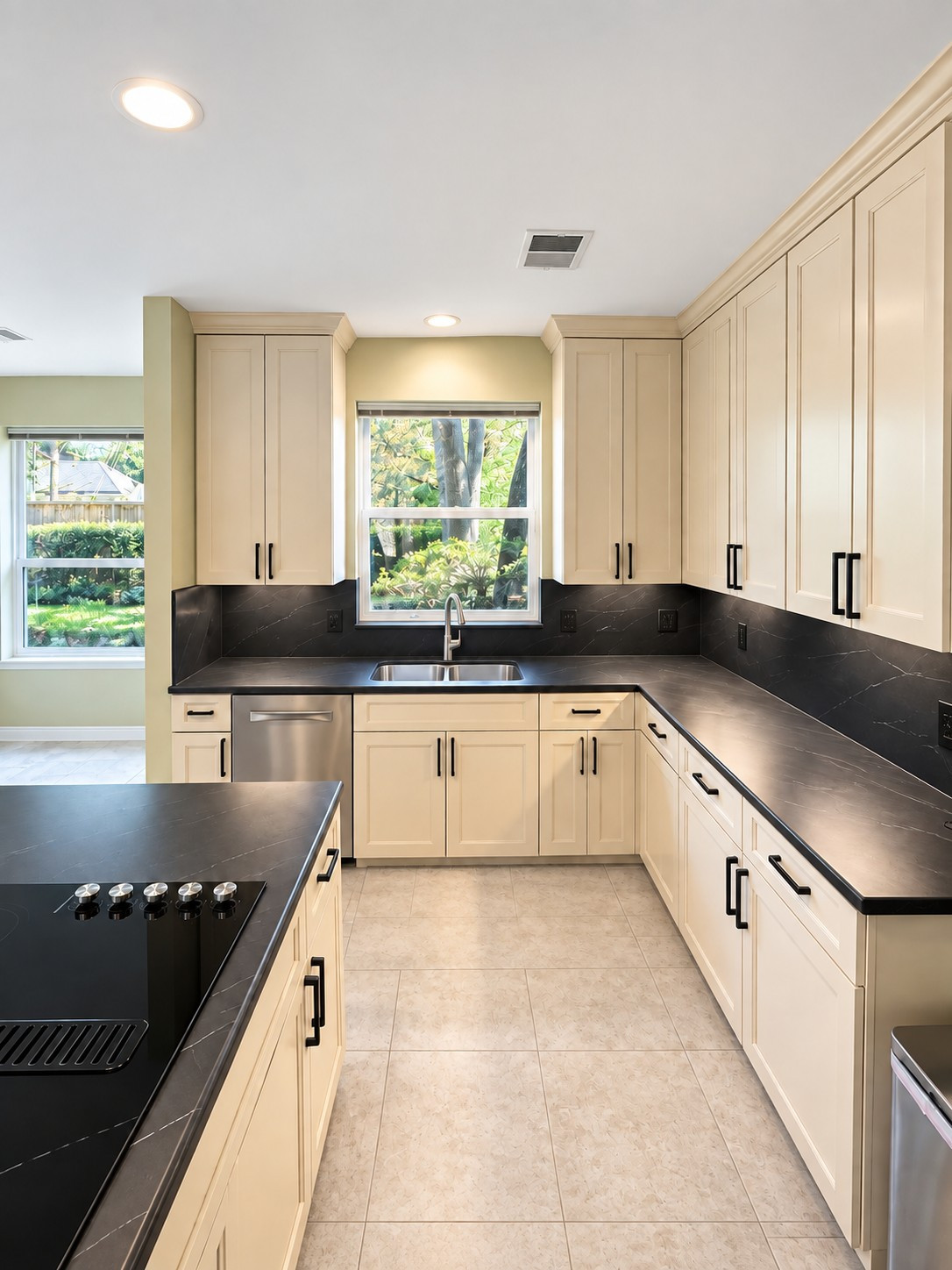Custom Transitional Kitchen with Cream Shaker Cabinets & Black Countertops
