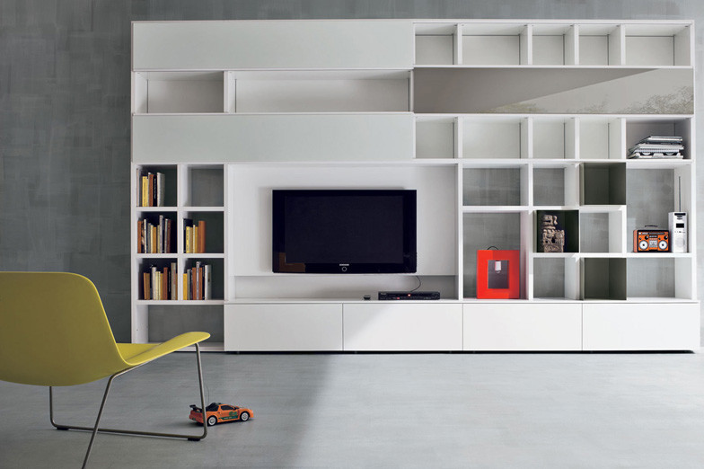 Example of a large minimalist formal and open concept concrete floor living room design in New York with gray walls