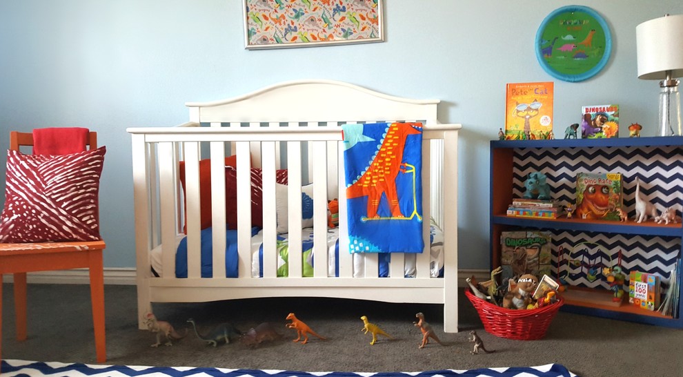 This is an example of a mid-sized transitional gender-neutral nursery in Los Angeles with blue walls, carpet and blue floor.