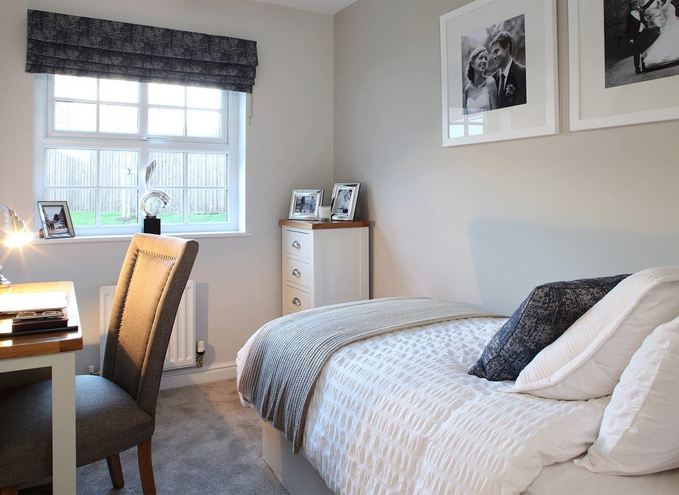 Design ideas for a small contemporary guest bedroom in Cheshire with beige walls, carpet, no fireplace and beige floor.
