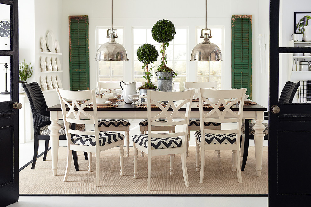 Photo of a mid-sized country separate dining room in Oklahoma City with white walls.