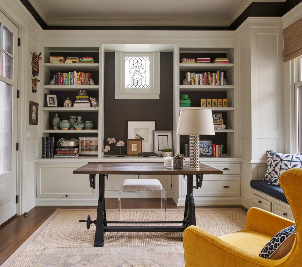 This is an example of a mid-sized contemporary study room with dark hardwood floors, no fireplace, a freestanding desk, grey walls and brown floor.