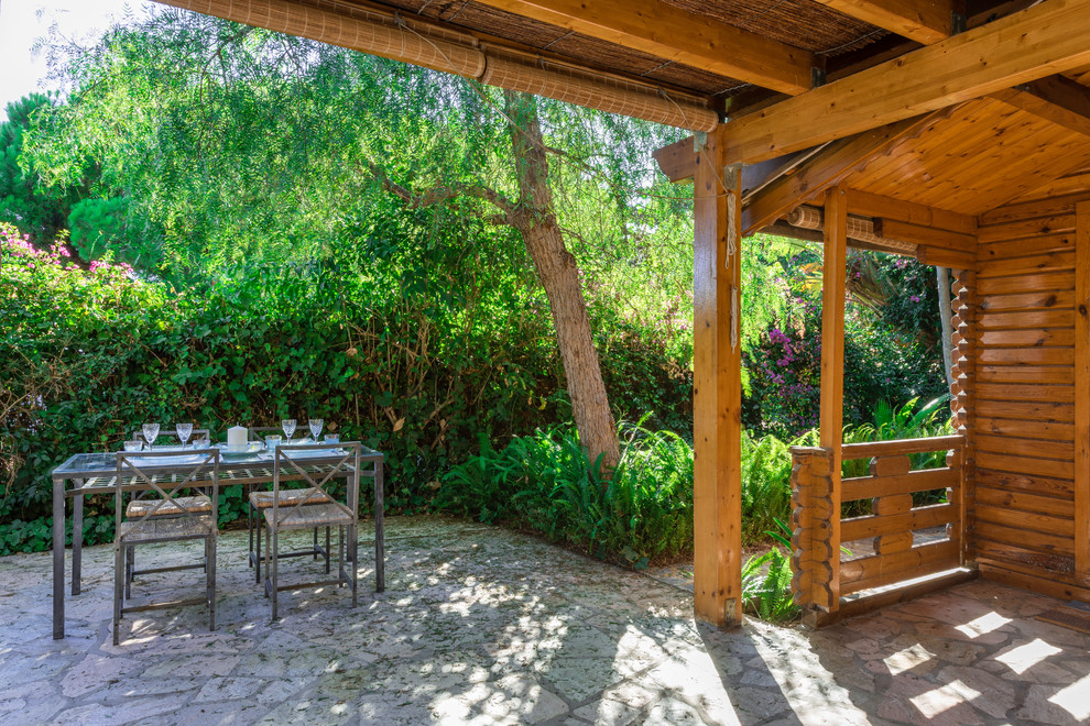 Ejemplo de patio in anexo de casas With adoquines de piedra natural