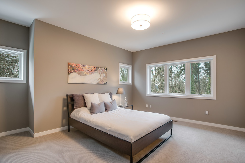Mid-sized transitional master bedroom in Seattle with beige walls, carpet, a two-sided fireplace, a plaster fireplace surround and beige floor.