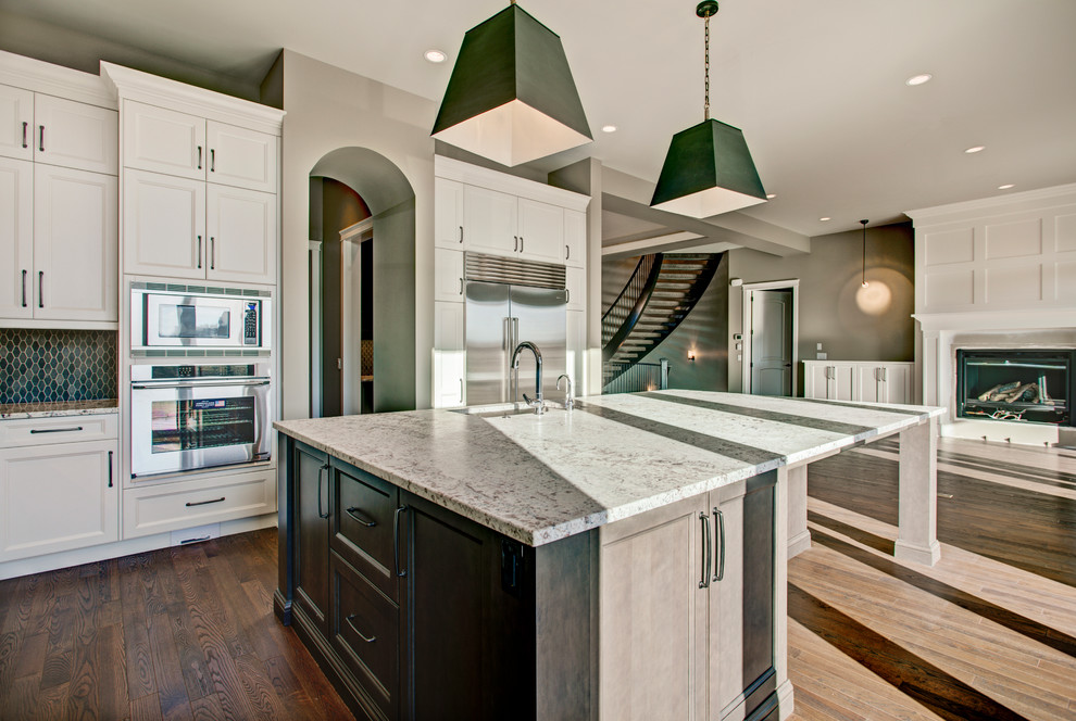 Example of a transitional kitchen design in Calgary