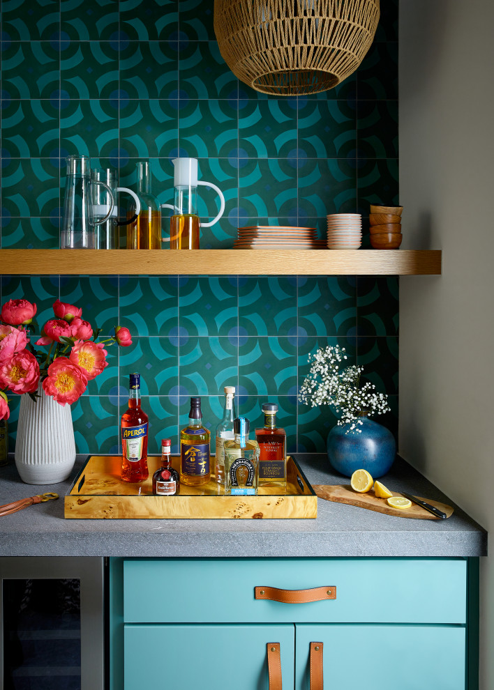 This is an example of a small modern single-wall dry bar in Austin with floating shelves, blue cabinets, soapstone worktops, blue splashback, ceramic splashback and grey worktops.