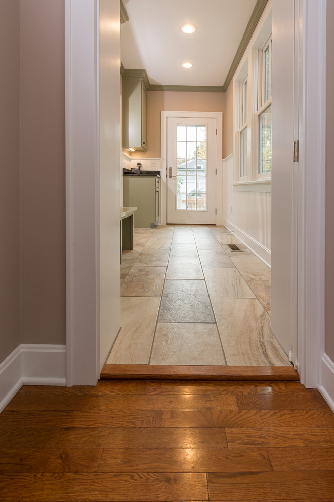 Inspiration for a mid-sized transitional mudroom in Columbus with beige walls, a single front door, a white front door and porcelain floors.