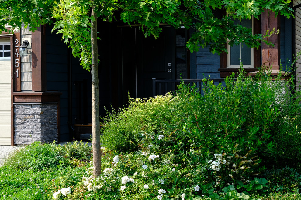 Mountain style home design photo in Vancouver