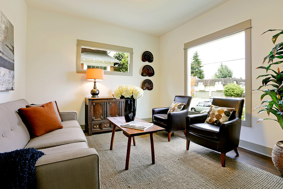 Photo of a transitional living room in Seattle with white walls.