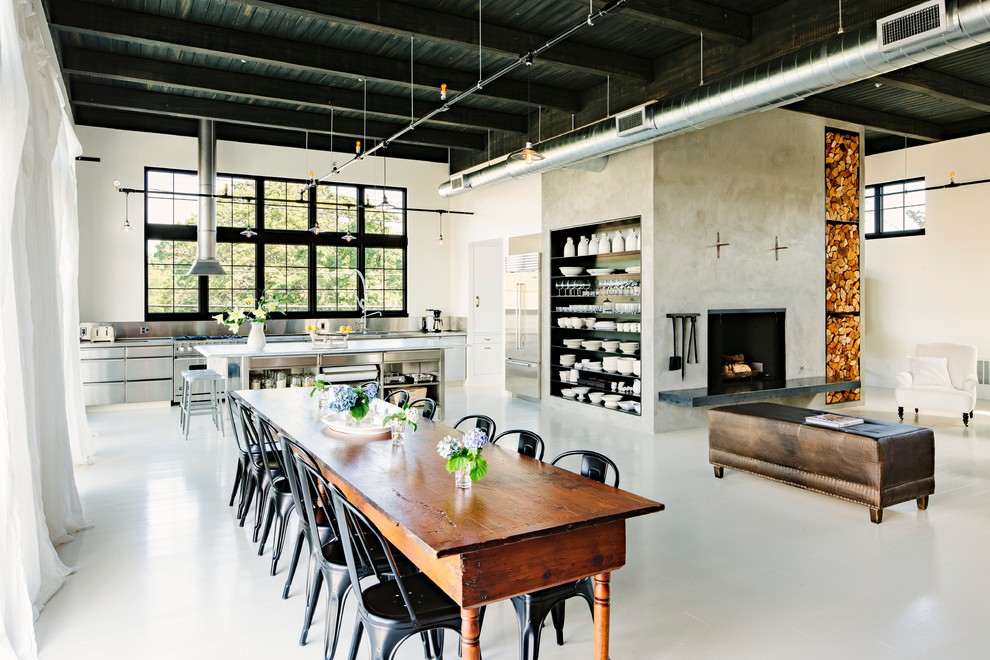 Industrial open plan dining in Portland with beige walls and white floor.