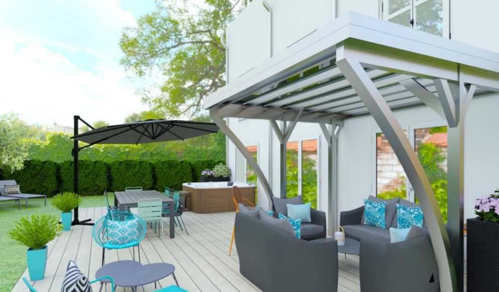 Photo of a large beach style back ground level terrace in Paris with a potted garden and a pergola.