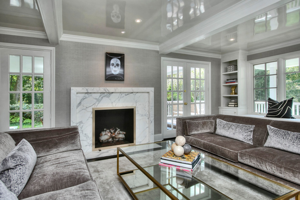 Photo of a large transitional enclosed living room in New York with grey walls, dark hardwood floors, a standard fireplace, a stone fireplace surround, no tv and black floor.