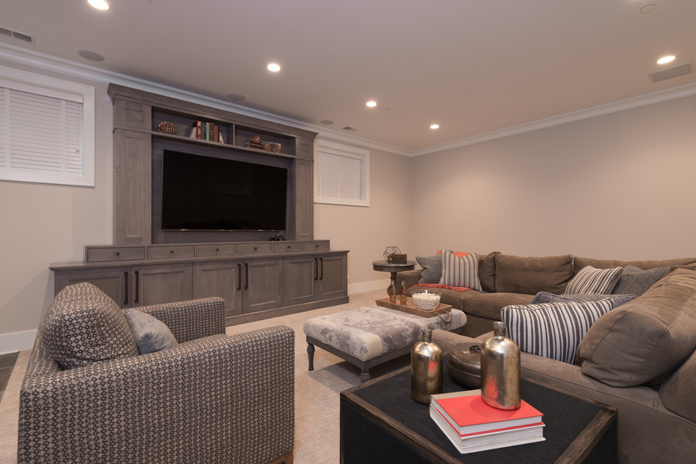 Large transitional family room in Chicago with beige walls, carpet and a built-in media wall.
