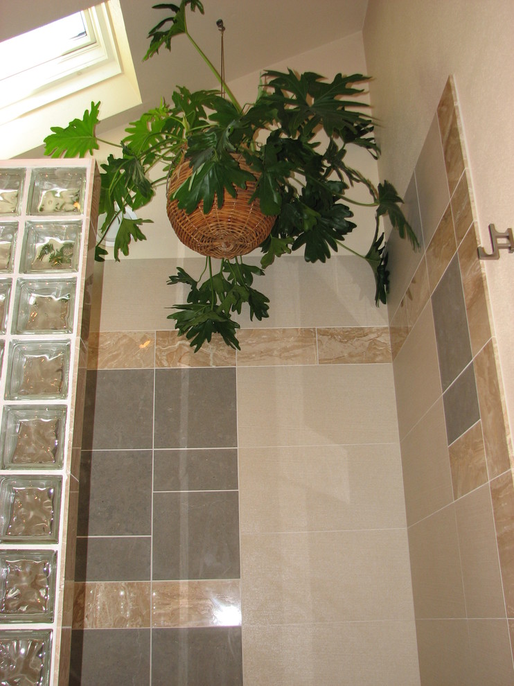 Inspiration for a large transitional master multicolored tile and porcelain tile marble floor and beige floor drop-in bathtub remodel in DC Metro with flat-panel cabinets, medium tone wood cabinets, a one-piece toilet, beige walls, an undermount sink and marble countertops