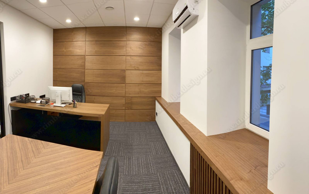 На фото: кабинет среднего размера в стиле модернизм с отдельно стоящим рабочим столом с