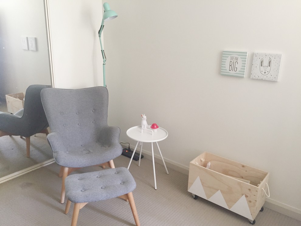 Design ideas for a mid-sized scandinavian kids' room for girls in Sydney with beige walls and carpet.