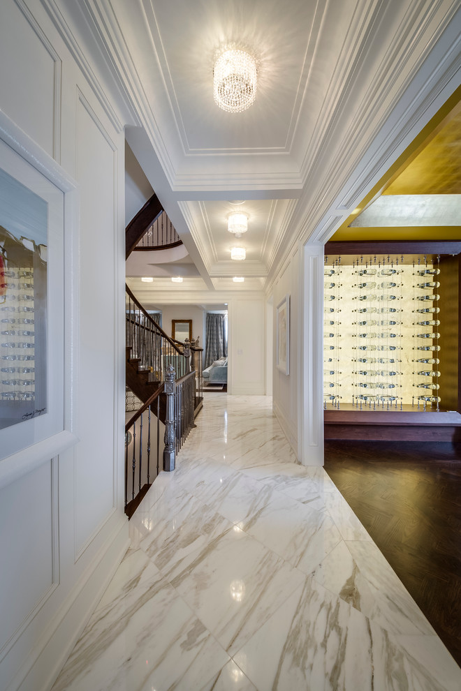 Photo of a modern hallway in Toronto with white walls and marble floors.