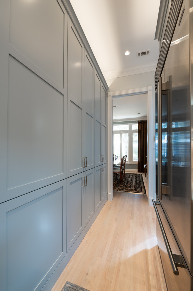 Large transitional u-shaped light wood floor and beige floor eat-in kitchen photo in Houston with shaker cabinets, gray cabinets, ceramic backsplash and stainless steel appliances