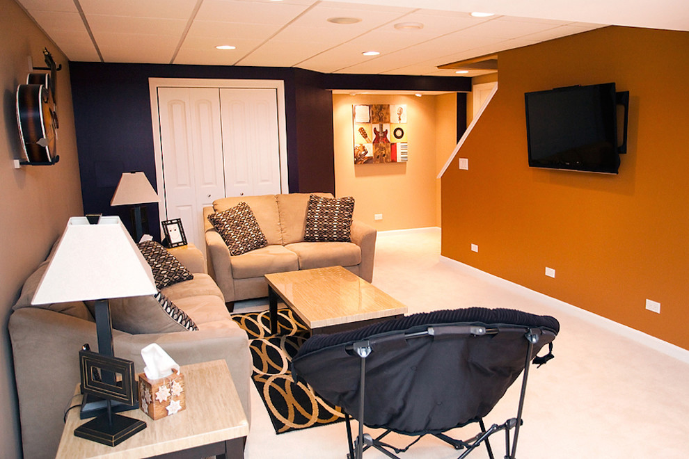 Design ideas for a large fully buried basement in Minneapolis with orange walls, carpet and no fireplace.