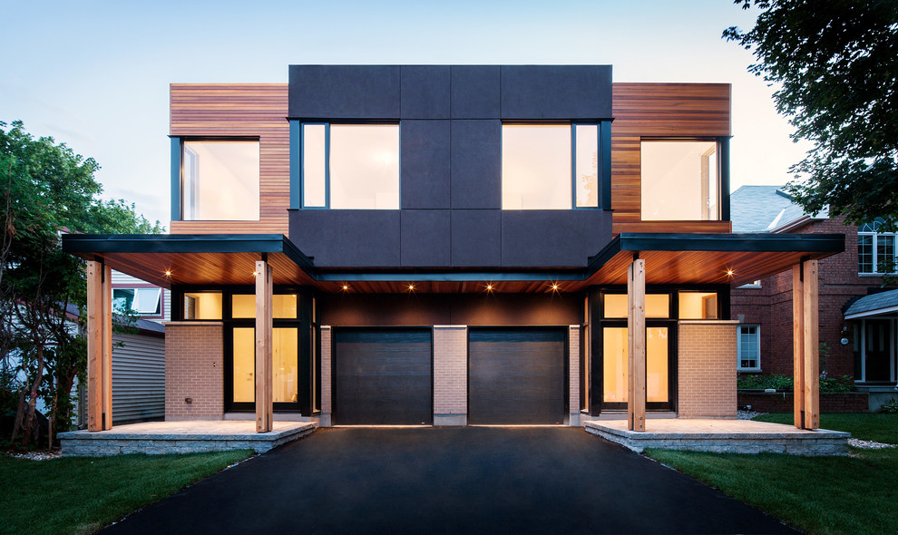 Photo of a contemporary duplex exterior in Ottawa with wood siding.