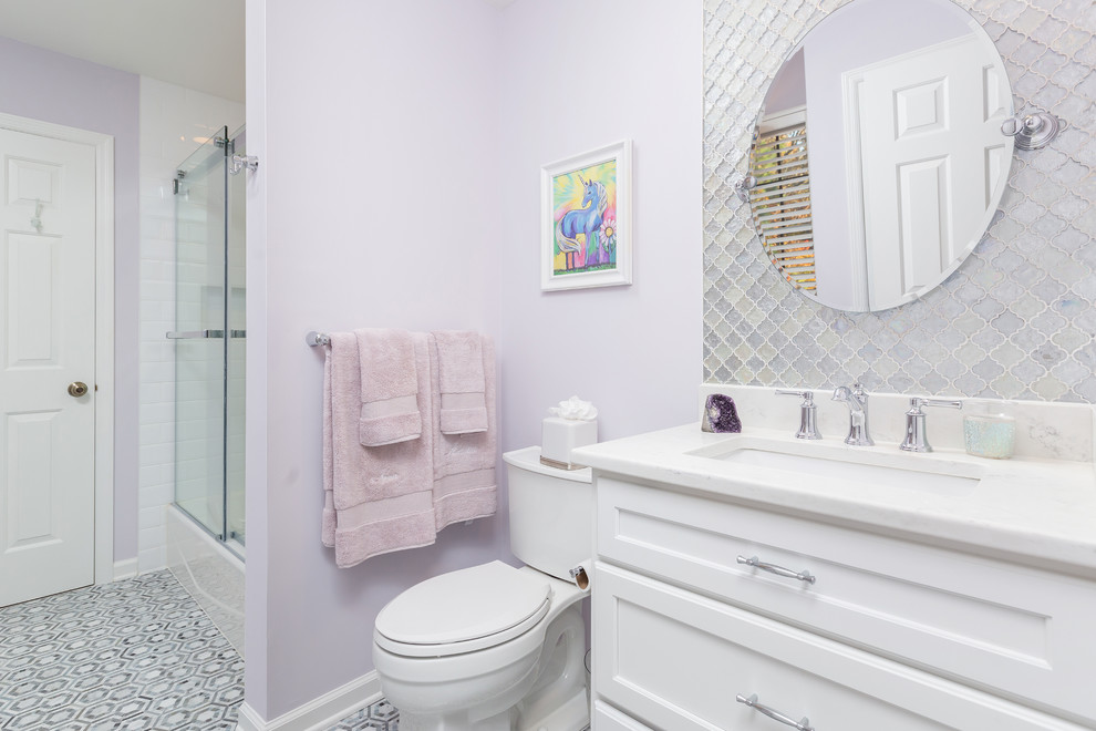 Design ideas for a mid-sized contemporary kids bathroom in Philadelphia with shaker cabinets, white cabinets, a shower/bathtub combo, purple walls, ceramic floors, an undermount sink and a sliding shower screen.