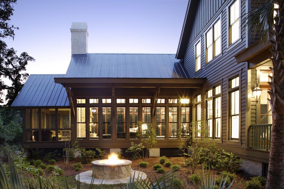 This is an example of a country exterior in Charleston with wood siding.