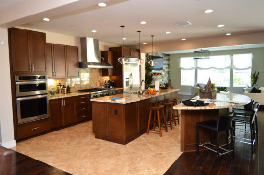 Design ideas for a mid-sized transitional kitchen in Orange County with brown floor.