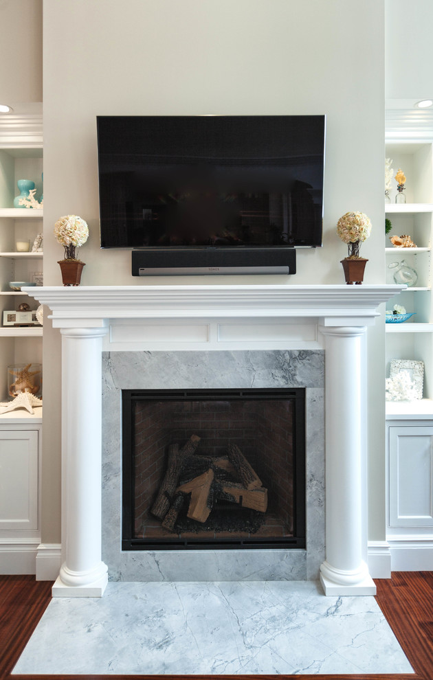 This is an example of a mid-sized traditional formal open concept living room in Portland Maine with white walls, a standard fireplace and a stone fireplace surround.