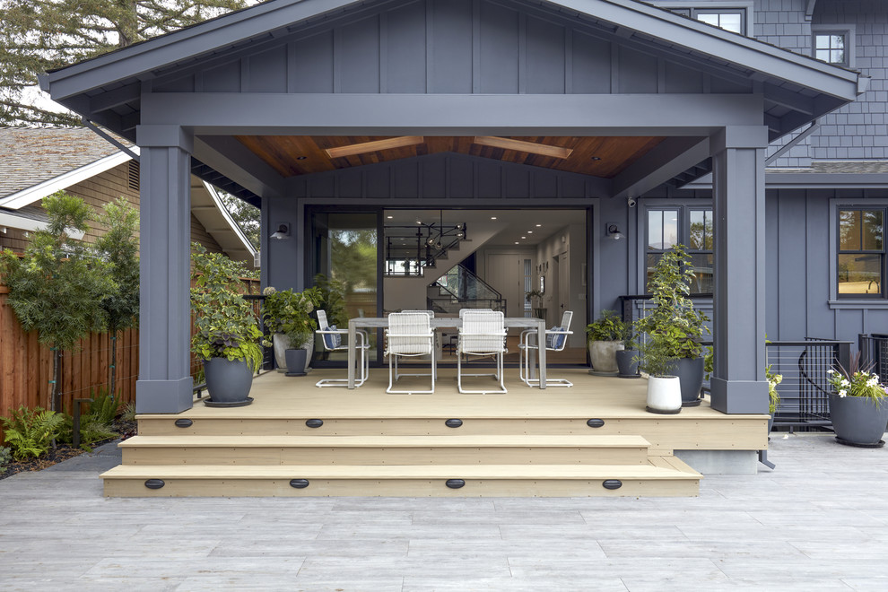 Large arts and crafts backyard deck in San Francisco with an awning.