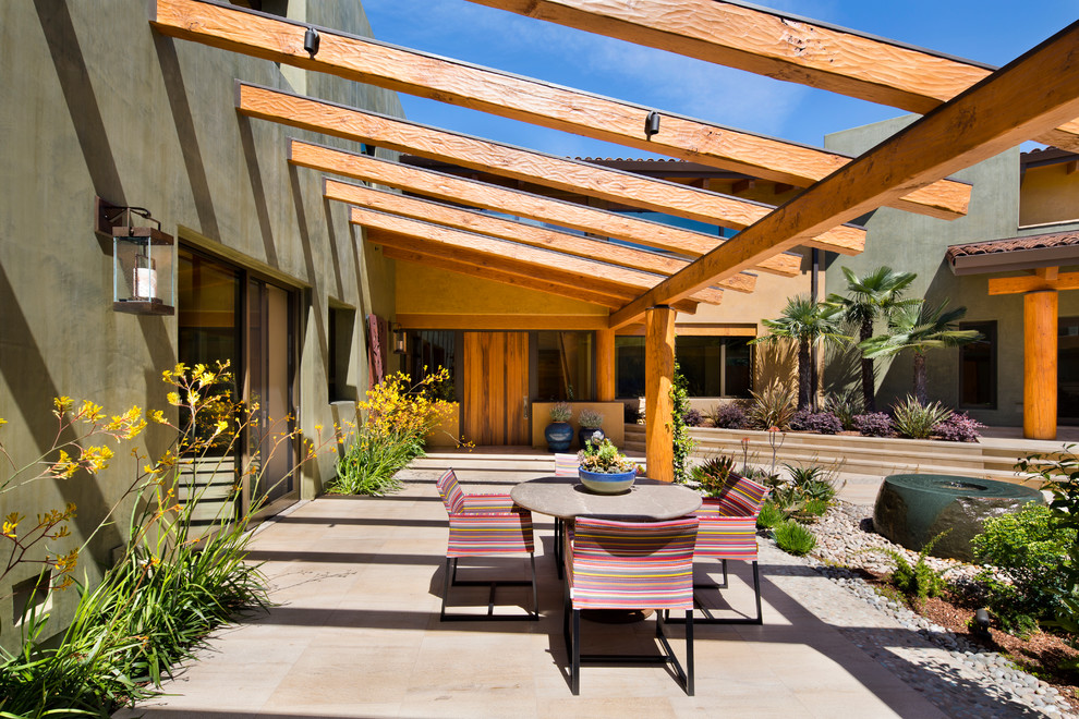 Inspiration for a large backyard patio in San Francisco with a water feature, a pergola and tile.