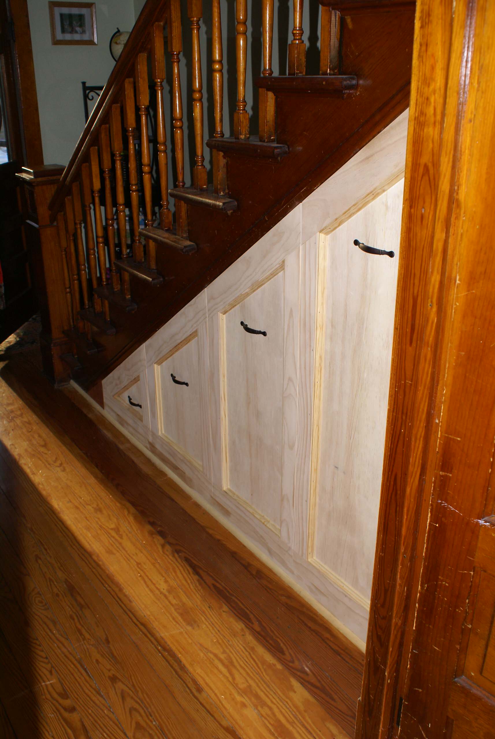 Entry hall closet built under stairs