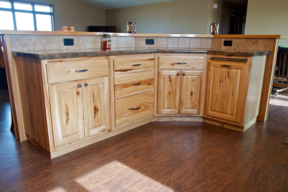 Mid-sized open concept kitchen photo with raised-panel cabinets, light wood cabinets and an island