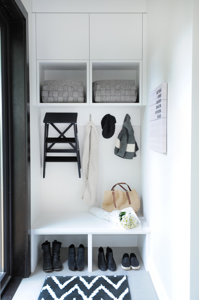 Inspiration for a contemporary mudroom in Vancouver with white walls.