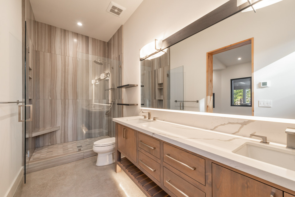 Example of a large trendy master white tile concrete floor, gray floor and double-sink shower bench design in San Francisco with flat-panel cabinets, white cabinets, a two-piece toilet, white walls, a drop-in sink, quartz countertops, white countertops and a built-in vanity