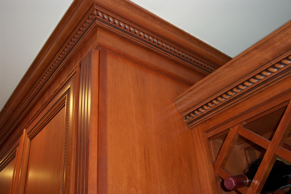 Example of a transitional l-shaped porcelain tile kitchen pantry design with a double-bowl sink, recessed-panel cabinets, medium tone wood cabinets, granite countertops, beige backsplash, stone tile backsplash, stainless steel appliances and no island