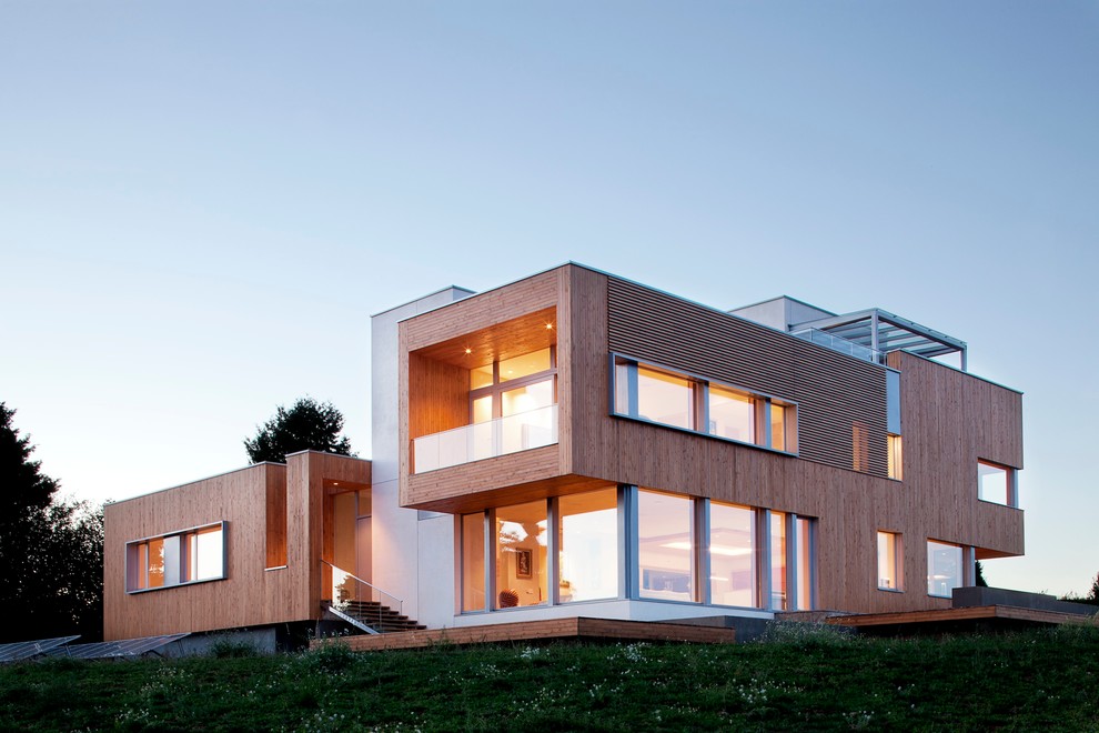 Photo of a contemporary exterior in Portland with wood siding.