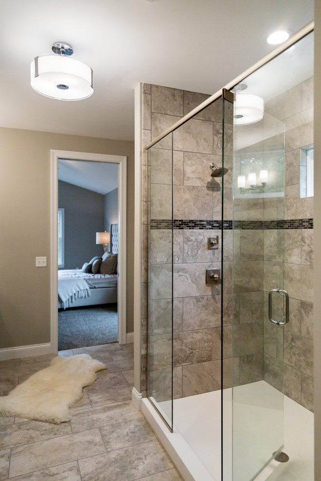 Large transitional master bathroom in St Louis with recessed-panel cabinets, dark wood cabinets, an alcove tub, an alcove shower, beige walls, ceramic floors, an undermount sink, granite benchtops, beige floor, a hinged shower door and beige benchtops.
