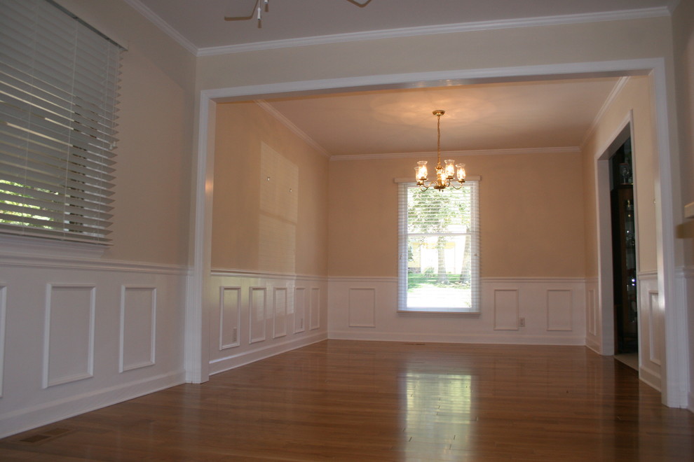 This is an example of a mid-sized traditional eat-in kitchen in Raleigh with medium hardwood floors.