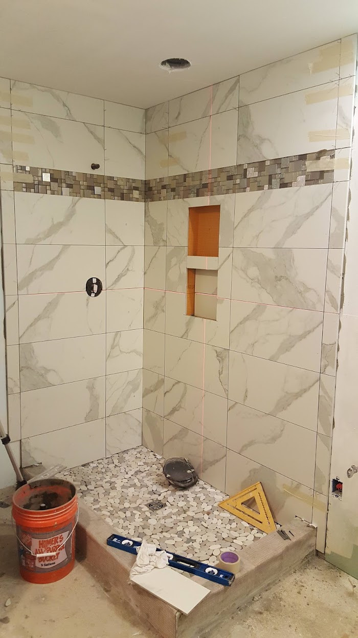 Tub to shower conversion