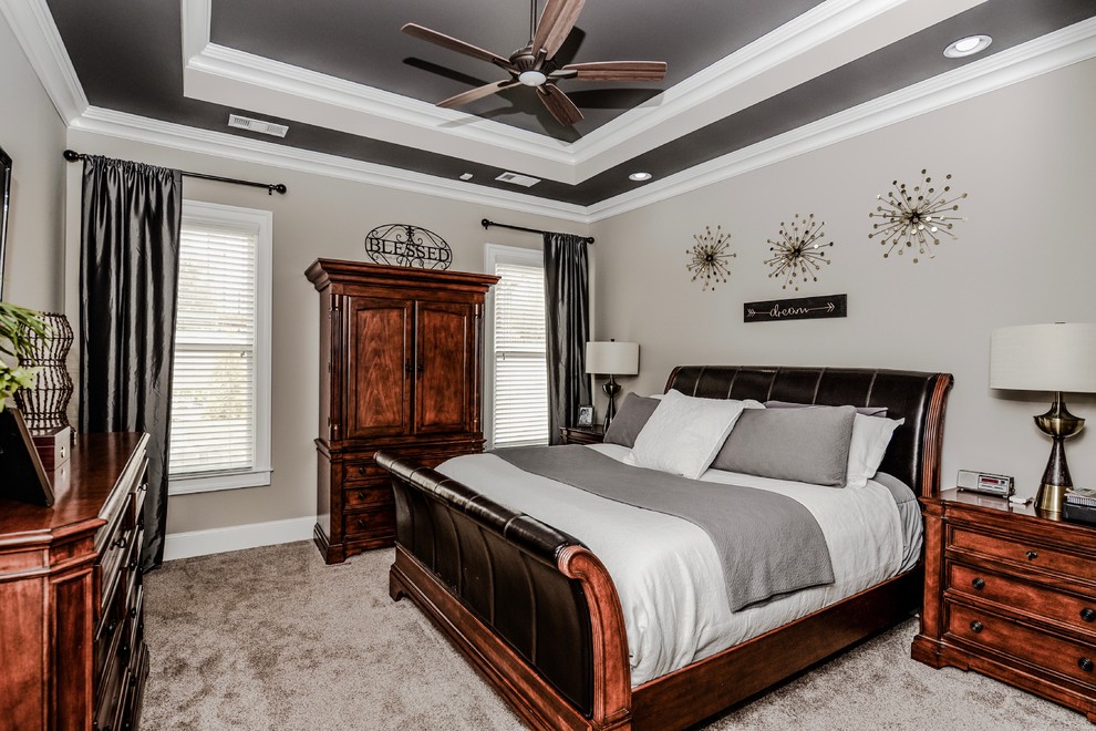 Design ideas for a mid-sized transitional master bedroom in Atlanta with grey walls and carpet.