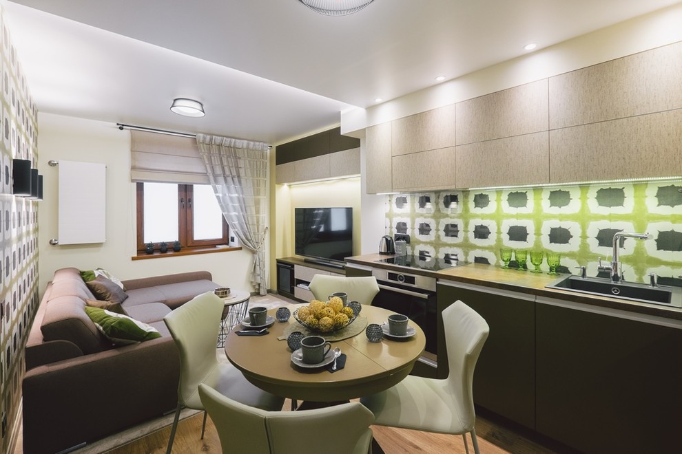 Inspiration for a small modern formal and enclosed light wood floor home design remodel with multicolored walls, no fireplace and a tv stand