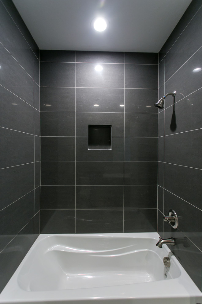 Inspiration for a mid-sized transitional gray tile and porcelain tile porcelain tile and beige floor alcove bathtub remodel in Seattle with shaker cabinets, dark wood cabinets, a two-piece toilet, gray walls, an undermount sink and quartz countertops